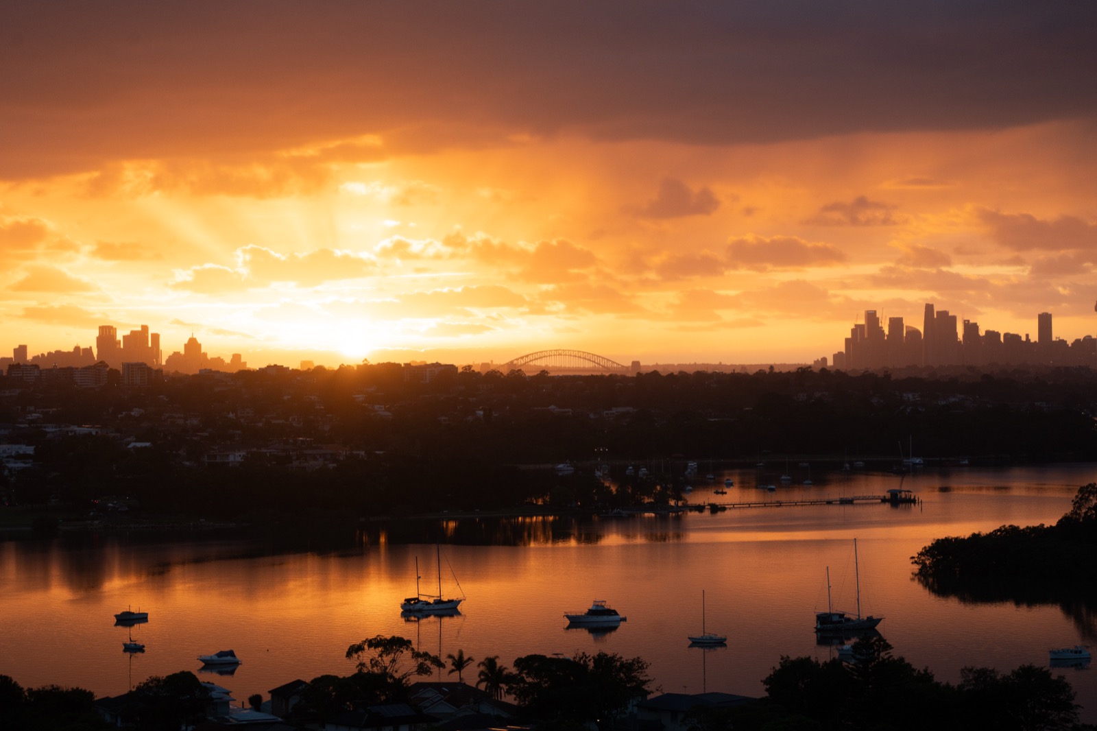 Sydney skyline at sunset over the harbour
